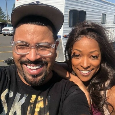 A smiling picture of Kellita Smith with her friend Tony Walk